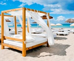 relaxing on a luxury beach bed in Ibiza